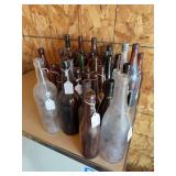 A large assortment of vintage glass bottles
