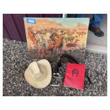 Western painting, English stirrups, farrier book and cowboy hat