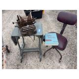 Vintage typing table with office chair, antique Oliver typewriter and college typewriting book