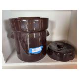 Brown crock with lid and applied handles includes two crock weights
