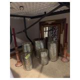 Graduated vases, candle sticks, wall mirror