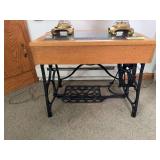 16.5D x 25L x 21H glass topped table w sewing machine base