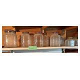 Various clear glass coffee jars and a shortening jar