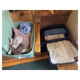 Three totes of towels, linens, and blankets