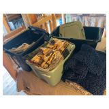 Three totes of miscellaneous linens, including towels, bedding, rugs