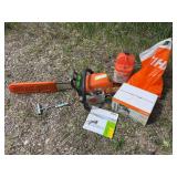 Stihl MS 290 chainsaw with full box of Motomix fuel, bar oil, and accessories