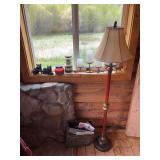 Rustic home decor, including candles, resin bears, candle holders, floor lamp, magazine rack