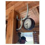 Antler wall hanging with clock, decorative keys, and metal display