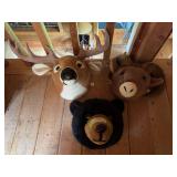 Stuffed animal deer head, sheep head, and bear head