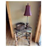 Rustic end table with slate top plus small table lamp and decorative basket
