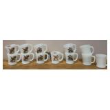 Twelve milk glass Fire King mugs, nine w fowl designs on them