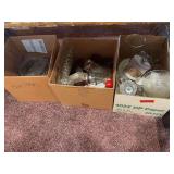 Three boxes of glassware includes various serving pieces, vases, etc