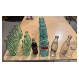 Various styles Coke bottles, blue Ball jars and three other old soda bottles