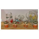 Three different pattern vintage glass pitchers and four juice glasses
