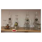 Variety of kerosene lamps and chimneys