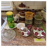 Soup bowls, juicer, ReaLemonade bottle, McDonalds coffee cup, etc