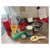 Tupperware, calzone maker, tea kettle, pans, coffee mugs, etc
