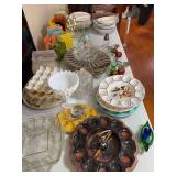 On table includes deviled egg servers, retro napkin holders, toothpick holders, snack plates, etc
