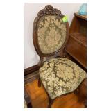 Ornately carved straight back chair