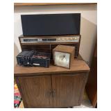 Motorola table top radio, Yamaha speaker, clock radio, strobe light and LP Record cabinet