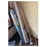 New curtain rods, oak handrail, new tennis rackets All appear new