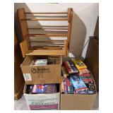 2 apple boxes full of VHS tapes and VHS shelves