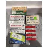 Eight boxes of 12 gauge shotgun shells and a box of 20 gauge