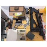 Assortment of gun parts and pieces
