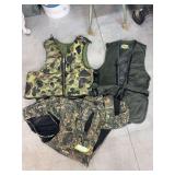 Two fishing vests and a lifejacket
