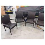 Set of four plastic wicker patio chairs