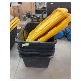 Four large black storage totes with lids