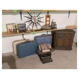 Hard side suitcases, humidifier, sunburst clock (broken), typewriter, etc