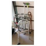 His and her walkers and canes and a set of crutches