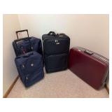 Three soft rolling  suitcases and one hard sided