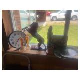 ￼ Wall clock, candleholders, decorative horse statue, native wood carving, decorative plates, and art