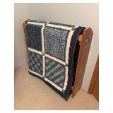 Large handmade blue and white quilt and handmade quilt stand