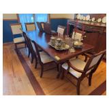 Dining table w eight chairs including 2 captains 42x70 (1) 18” leaf One leg has been chewed on by a pet, see photos NO CONTENTS!!
