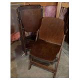 Seven wooden theatre seat type chairs
