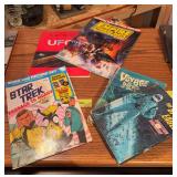 Books includes The Space Eagle, Voyage to the Bottom of the Sea, Empire Strikes Back magazine (front cover damaged), Star Trek Book and Record, Super book of UFOs