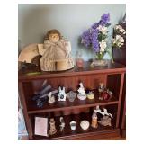 Angel made from hymnal, flowers, perfume, votive holders etc