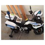 Childs motorized BMW Police car. See photo for model number