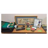 All things golf includes mechanical bank, books, portable putting, postcards
