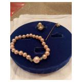 Pearl bracelet, stick pin, ring