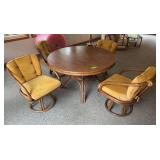 48" round table and 4 chairs split bamboo, one chair pad is torn.
