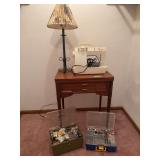Singer sewing machine, walnut cabinet and 2 boxes of sewing notions