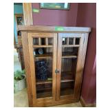 Modern oak cabinet with three shelves, does have a small hole in the back It was a media cabinet in it