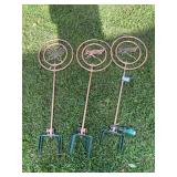 Three copper garden water spinners