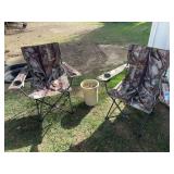 Two camo fold up camp chairs