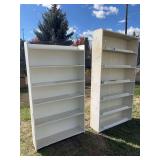 Two large white, very heavy wood bookshelves - 48 x 12 x 7‘ and 40 x 10 x 6‘