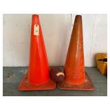 2 Orange traffic cones and a football
